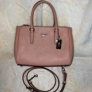 Small pink leather Coach purse.